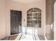 Inviting front door with a welcome mat and charming window allowing natural light to fill the entryway at 35229 Janine Dr, Zephyrhills, FL 33541