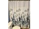 Bathroom featuring a floral-patterned shower curtain over a tub and toilet with white trim at 3615 Pine Knot Dr, Valrico, FL 33596