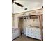 Well-organized Bedroom featuring a changing table, closet space, and charming decor at 3615 Pine Knot Dr, Valrico, FL 33596
