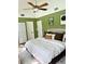 Bright bedroom boasts a vaulted ceiling and ample natural light, creating a serene atmosphere at 3615 Pine Knot Dr, Valrico, FL 33596