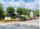 The Pine Grove entrance sign set amongst the mature trees and landscaping at 3615 Pine Knot Dr, Valrico, FL 33596