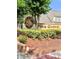 Pine Grove community entrance with lush landscaping, and attractive signage at 3615 Pine Knot Dr, Valrico, FL 33596