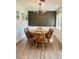 Comfortable dining area features wood chairs, tile-top table and a decorative wall at 3615 Pine Knot Dr, Valrico, FL 33596