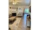 Bright living room with a fireplace, neutral decor, and sliding glass doors to the outside at 3615 Pine Knot Dr, Valrico, FL 33596