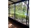 Enjoy serene pond views from this peaceful screened patio, perfect for outdoor relaxation at 3615 Pine Knot Dr, Valrico, FL 33596
