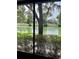 This home boasts a stunning view of the pond and lush landscaping at 3615 Pine Knot Dr, Valrico, FL 33596