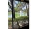 Relaxing view of the pond featuring a fountain from the screened in patio area at 3615 Pine Knot Dr, Valrico, FL 33596