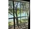 Great natural lighting and a tranquil view of the lake from the bedroom window at 3615 Pine Knot Dr, Valrico, FL 33596