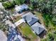 Aerial view of the home highlighting its layout with lush landscaping and a convenient driveway at 37230 Poinsettia Ave, Dade City, FL 33525