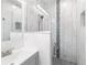 Bathroom featuring vanity sink, glass enclosed shower with tile backsplash, and modern fixtures at 37230 Poinsettia Ave, Dade City, FL 33525