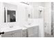 Bathroom featuring dual vanity sinks and a glass enclosed shower with tile backsplash at 37230 Poinsettia Ave, Dade City, FL 33525