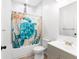 Bathroom featuring a vanity sink, toilet, and shower with a decorative curtain at 37230 Poinsettia Ave, Dade City, FL 33525