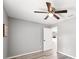 Cozy bedroom with a ceiling fan and wood-look floors, providing a modern and comfortable space at 37230 Poinsettia Ave, Dade City, FL 33525