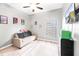 Bedroom featuring a sofa, tv, ceiling fan, and bright natural light at 37230 Poinsettia Ave, Dade City, FL 33525