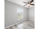 Bedroom with light gray walls and vinyl flooring at 37230 Poinsettia Ave, Dade City, FL 33525