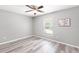 Bedroom with light gray walls and vinyl flooring at 37230 Poinsettia Ave, Dade City, FL 33525