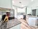 Contemporary kitchen with stainless steel appliances, granite counters, and a built-in wine cooler at 37230 Poinsettia Ave, Dade City, FL 33525