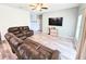 Comfortable living room featuring a ceiling fan, wood floors, and gray walls at 37230 Poinsettia Ave, Dade City, FL 33525