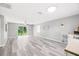 Spacious living room with gray walls and vinyl flooring at 37230 Poinsettia Ave, Dade City, FL 33525
