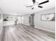 Spacious living room with gray walls and vinyl flooring at 37230 Poinsettia Ave, Dade City, FL 33525