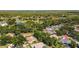 Panoramic aerial view of a tree-filled community, highlighting the property's location at 3922 Cedar Cay Circle, Valrico, FL 33596