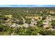 Wide aerial view of a verdant community, highlighting a property with a pin to show location at 3922 Cedar Cay Circle, Valrico, FL 33596