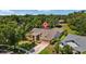 Aerial view of a house situated in a neighborhood with mature landscaping and lush, green trees at 3922 Cedar Cay Circle, Valrico, FL 33596