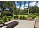 Backyard patio with a chaise lounge and a view of the lawn at 3922 Cedar Cay Circle, Valrico, FL 33596
