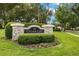 Stone sign at the entrance to Cedar Cay neighborhood, surrounded by landscaping and shrubbery at 3922 Cedar Cay Circle, Valrico, FL 33596