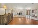 Formal dining area featuring wood floors, an elegant chandelier, and lots of natural light at 3922 Cedar Cay Circle, Valrico, FL 33596
