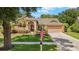 Charming single-story home with a well-manicured lawn, brick accents, and an attached two-car garage at 3922 Cedar Cay Circle, Valrico, FL 33596