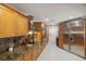 Spacious kitchen features stainless steel appliances, granite countertops, tile flooring and stylish wood cabinets at 3922 Cedar Cay Circle, Valrico, FL 33596