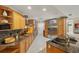 This gourmet kitchen features stainless steel appliances, granite counters, tile floors, and ample cabinetry at 3922 Cedar Cay Circle, Valrico, FL 33596