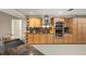 Bright kitchen features a stainless steel appliance suite, granite counters, and stylish cabinetry at 3922 Cedar Cay Circle, Valrico, FL 33596