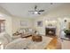 Cozy living room featuring a fireplace, neutral color palette, and hardwood floors at 3922 Cedar Cay Circle, Valrico, FL 33596