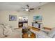 Inviting living area with a fireplace, a comfortable seating arrangement and TV at 3922 Cedar Cay Circle, Valrico, FL 33596