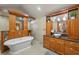 This spa-like bathroom features a soaking tub, granite counters, double vanity, and tiled shower at 3922 Cedar Cay Circle, Valrico, FL 33596