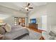 Spacious main bedroom features a vaulted ceiling, ceiling fan, and access to the pool at 3922 Cedar Cay Circle, Valrico, FL 33596