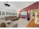 Spacious media room with a large projection screen, plush seating, and modern lighting at 3922 Cedar Cay Circle, Valrico, FL 33596