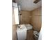 Bathroom features a white sink and vanity, tub, tiled walls, and standard toilet at 3950 45Th N Ave, St Petersburg, FL 33714