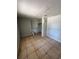 Bedroom with tiled flooring, a window with blinds, and a closet space at 3950 45Th N Ave, St Petersburg, FL 33714