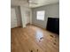 Bedroom with wood flooring, a window, and a closet at 3950 45Th N Ave, St Petersburg, FL 33714