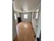 Bedroom with wood floors, a ceiling fan, and multiple windows at 3950 45Th N Ave, St Petersburg, FL 33714