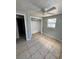 Simple bedroom with ceiling fan and a closet at 3950 45Th N Ave, St Petersburg, FL 33714