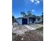 Exterior view of home with attached garage and front porch at 3950 45Th N Ave, St Petersburg, FL 33714