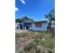 Home exterior with fenced in yard and covered porch at 3950 45Th N Ave, St Petersburg, FL 33714