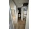 Hallway view showcasing access to bathroom and other rooms at 3950 45Th N Ave, St Petersburg, FL 33714