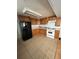 Spacious kitchen with tile floors, wood cabinetry, and modern appliances at 3950 45Th N Ave, St Petersburg, FL 33714