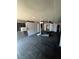 Open living room with natural light, featuring dark floors and light grey walls at 3950 45Th N Ave, St Petersburg, FL 33714
