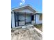 Covered front porch with lattice work and concrete floor at 3950 45Th N Ave, St Petersburg, FL 33714